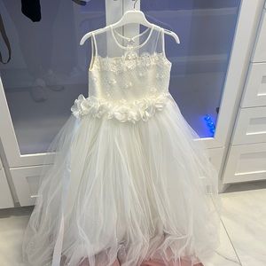 Flower girl dress. White, elegant and poofy. Used once.